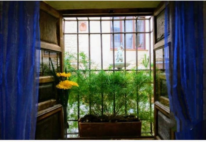 Quarto em Acomodações Particulares En Casa Con Encanto,
